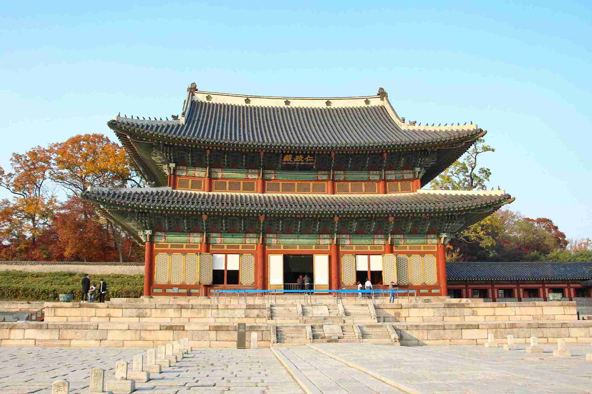 Palace with dark blue tiled roof and red and green walls